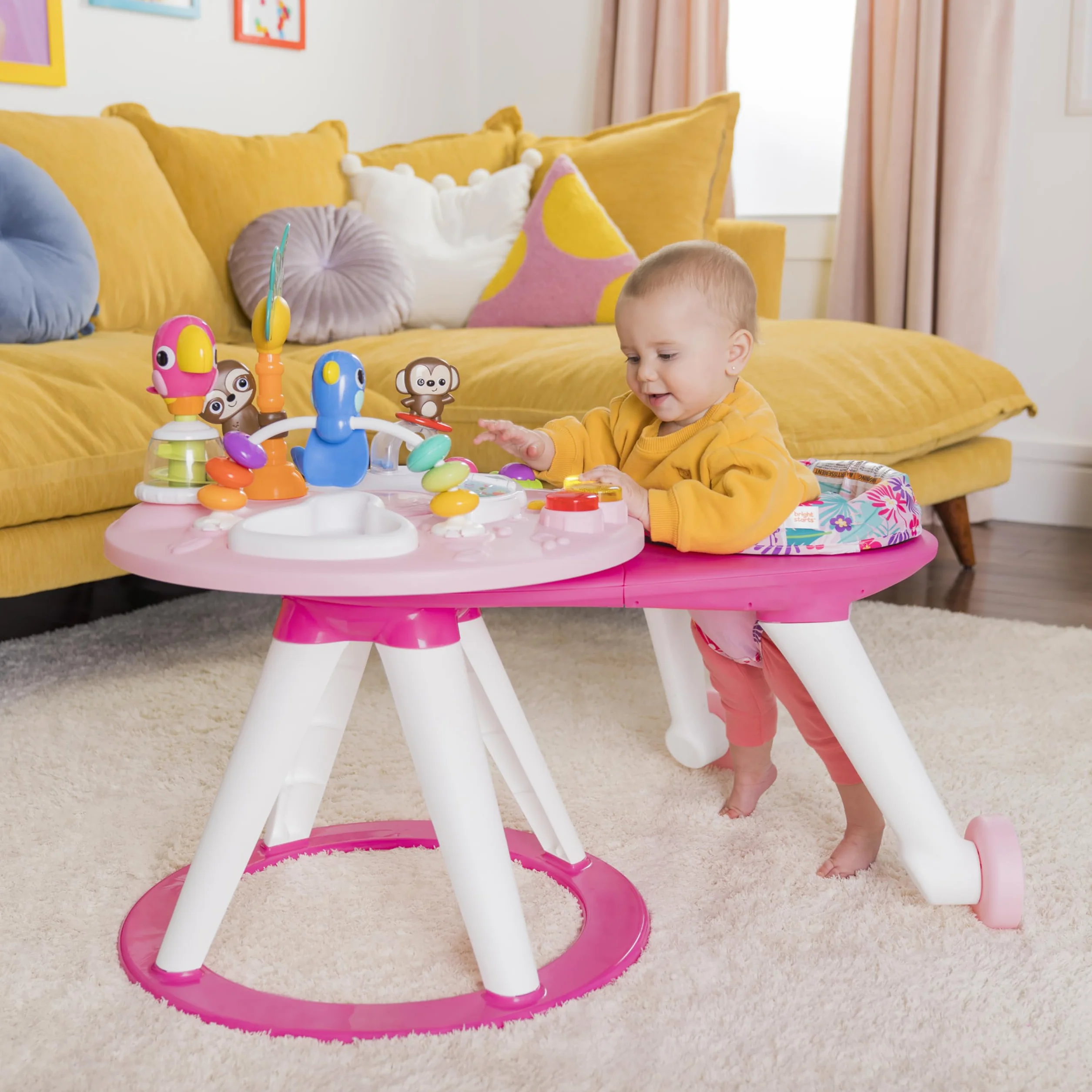 Bright Starts Table et Siège Tournant Centre d'Activités 2 en 1 Around We Go avec Sons et Lumières 10 Jouets Trotteur Musical Rose 6 Mois+
